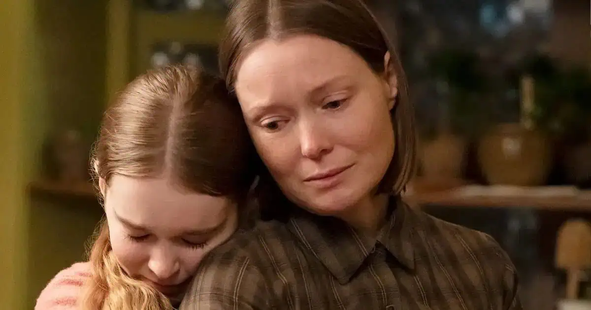 A woman holds a young girl close in a still from Prime Video's Carrie.